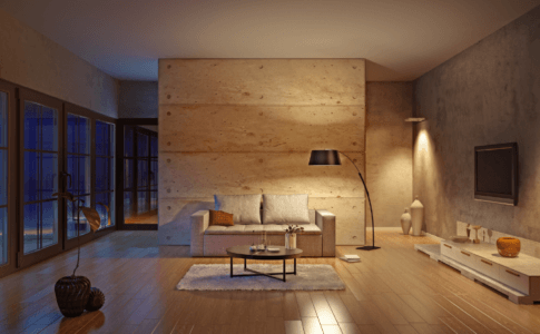 Modern eingerichtetes Wohnzimmer mit verschiedenen Lichtquellen und Abendlicht