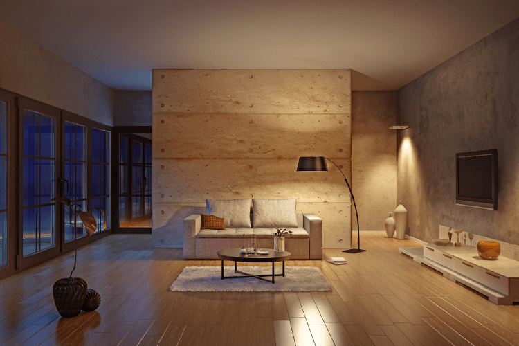 Modern eingerichtetes Wohnzimmer mit verschiedenen Lichtquellen und Abendlicht